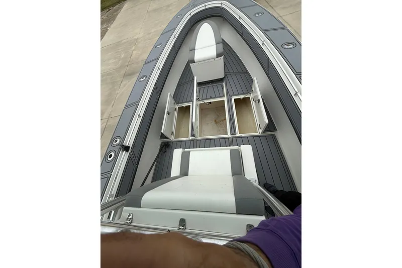 Slide: The Image of 2008 Contender 36 Open boat deck with open storage compartments. - 20