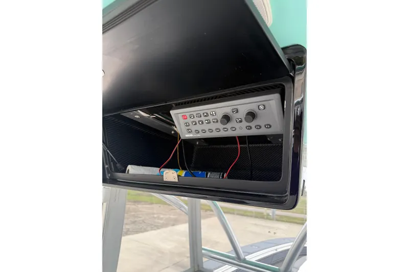 Slide: The Image of 2008 Contender 36 Open boat control panel with wiring and switches. - 24