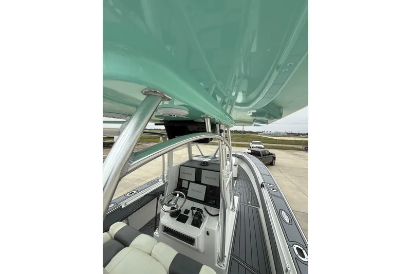 Slide: The Image of 2008 Contender 36 Open boat interior with advanced navigation system and sleek design. - 26