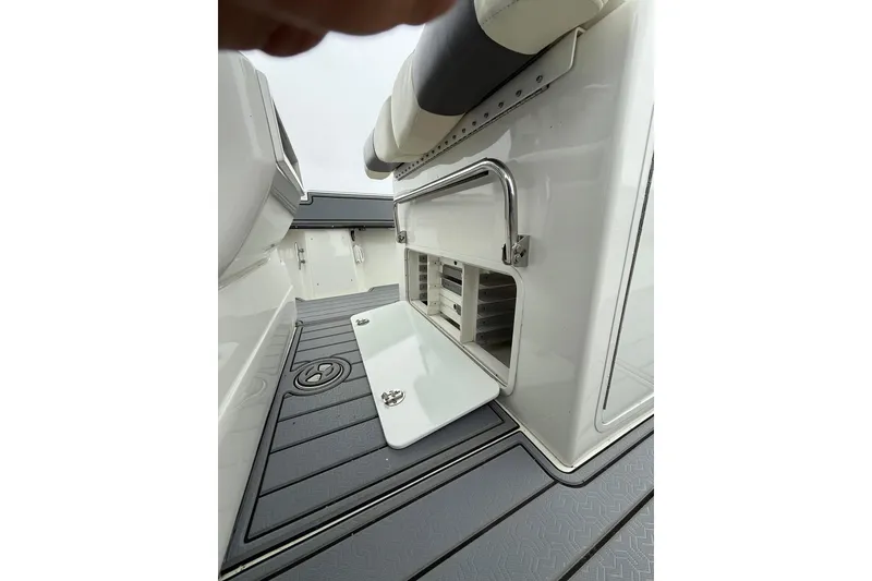 Slide: The Image of 2008 Contender 36 Open boat interior with storage compartment and cushioned seating. - 27