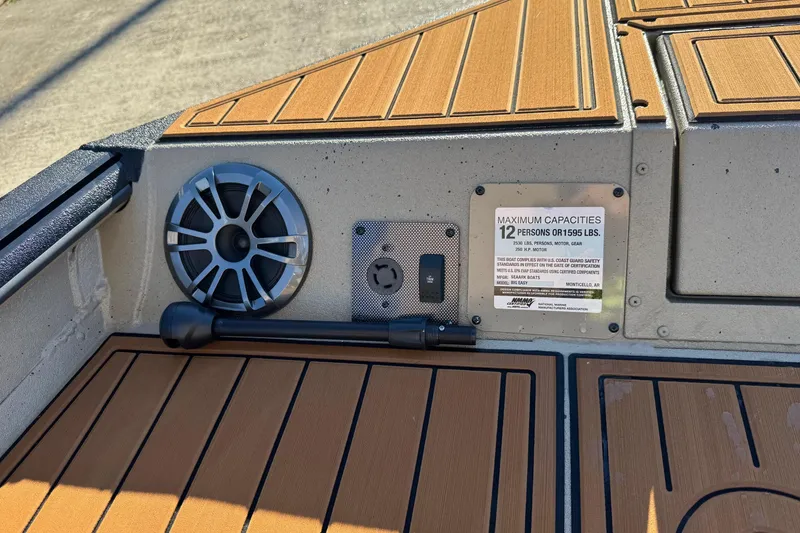 Slide: The Image of 2026 SeaArk Big Easy boat interior with speaker and capacity plate. - 10