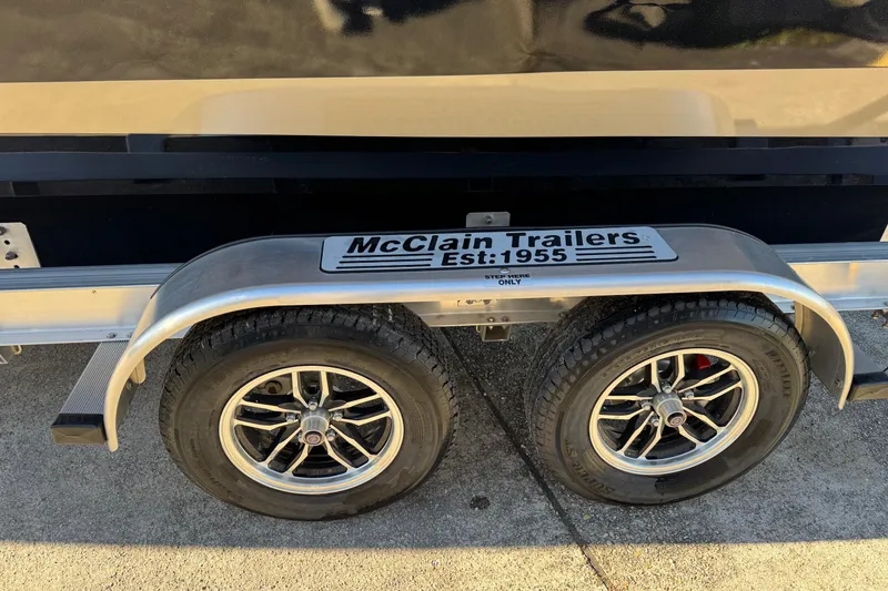 Slide: The Image of 2026 SeaArk Big Easy on McClain trailer, dual wheels, sunny day. - 3