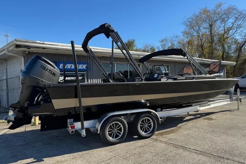 Slide: The Image of 2026 SeaArk Big Easy boat on trailer with Suzuki outboard motor. - 6