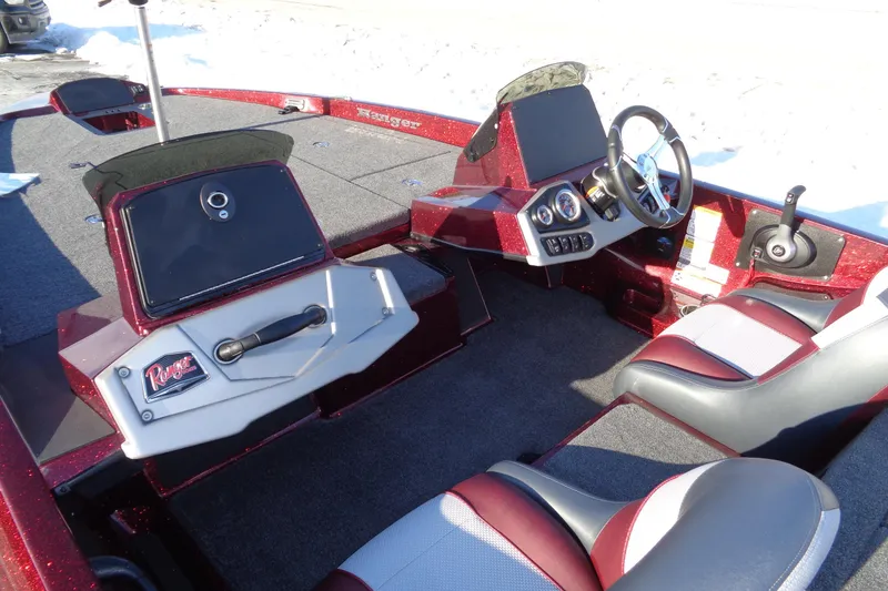 Slide: The Image of 2026 Ranger Z185 boat interior with steering wheel, seats, and control panel. - 13