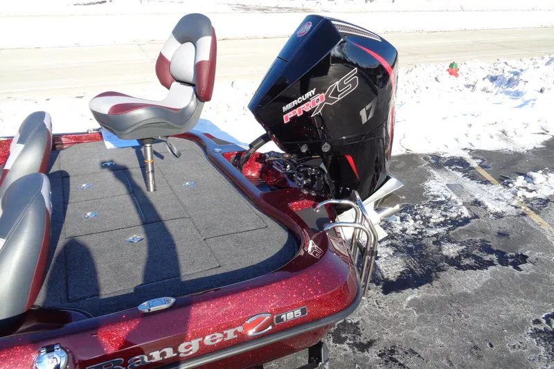 Slide: The Image of 2026 Ranger Z185 boat with Mercury Pro XS engine, parked on snowy pavement. - 16
