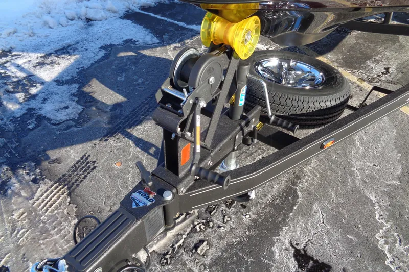 Slide: The Image of Trailer hitch and winch system of 2026 Ranger Z185 on icy pavement. - 18