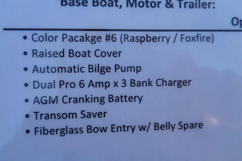 Slide: The Image of 2026 Ranger Z185 features: Raspberry/Foxfire color, raised cover, bilge pump, battery charger, AGM battery. - 20