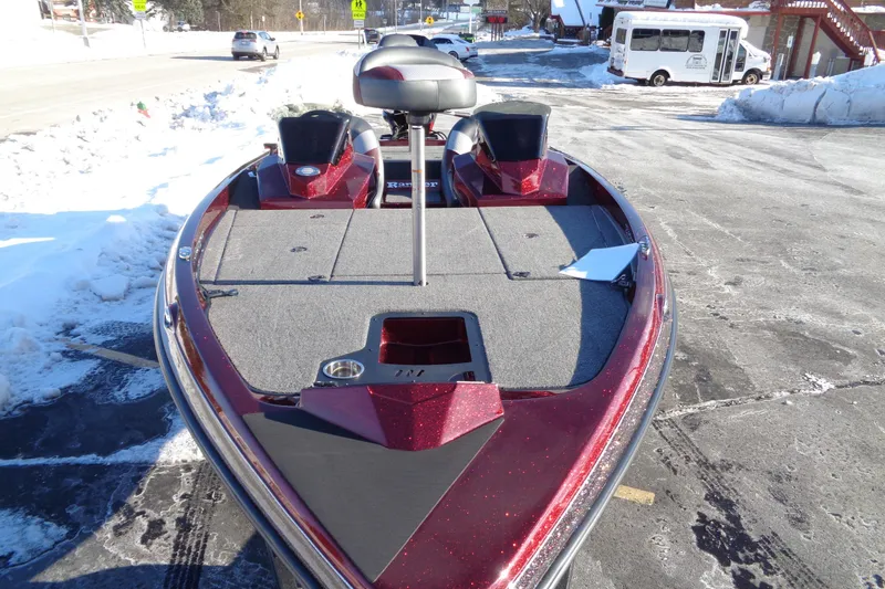 Slide: The Image of 2026 Ranger Z185 boat with red exterior, parked on snowy pavement. - 5