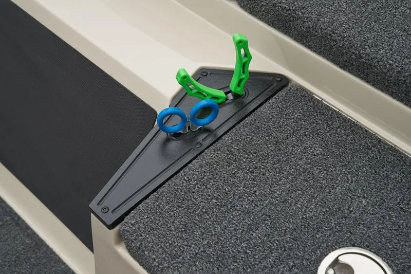 Slide: The Image of Manufacturer Provided Image: 2026 Ranger Z185 boat deck with green and blue clips on a textured surface. - 52