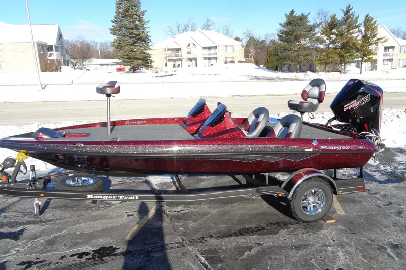 Slide: The Image of 2026 Ranger Z185 boat on trailer, red finish, parked in snowy setting. - 6