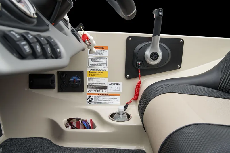 Slide: The Image of Manufacturer Provided Image: 2026 Ranger Z185 boat console with control lever and warning labels. - 64