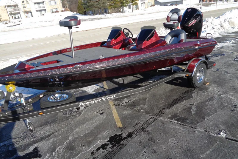 Slide: The Image of 2026 Ranger Z185 boat on trailer in snowy parking lot. - 7