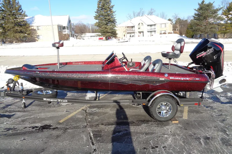 Slide: The Image of 2026 Ranger Z185 boat on trailer in snowy parking lot. - 8