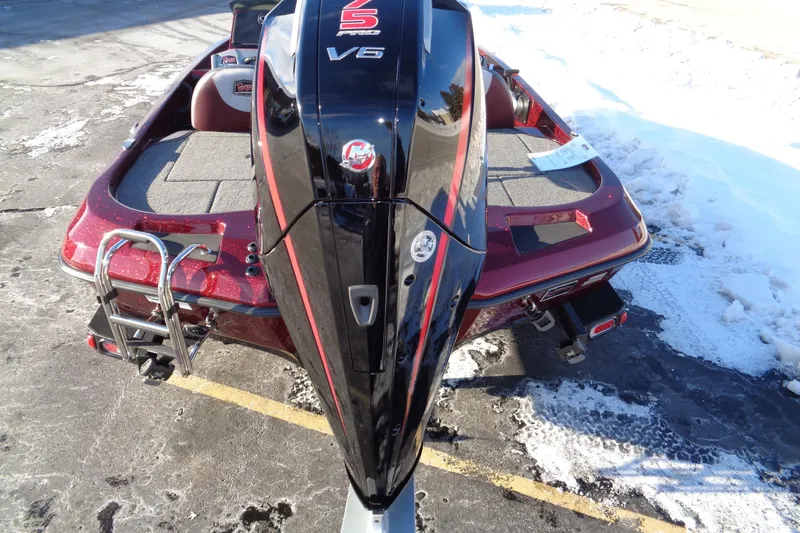 Slide: The Image of 2026 Ranger Z185 boat with V6 engine, parked on snowy pavement. - 9