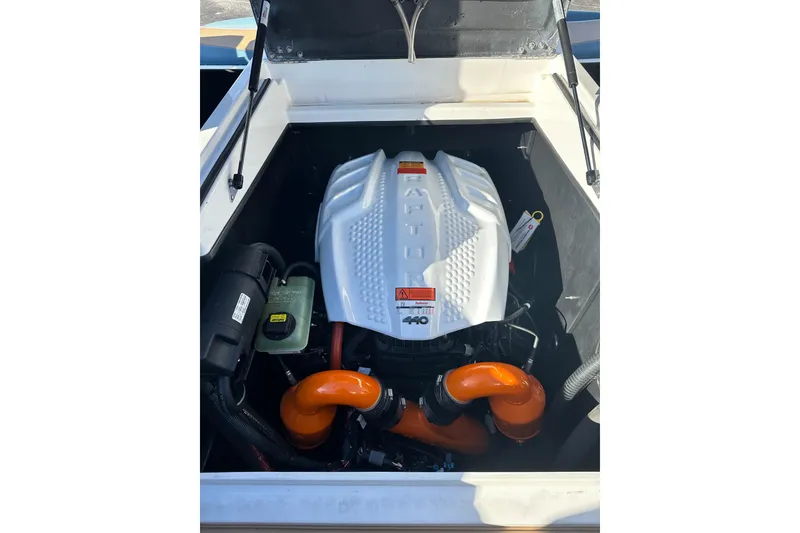 Slide: The Image of 2023 Tigé 23ZX boat engine compartment with Raptor 440 engine. - 13