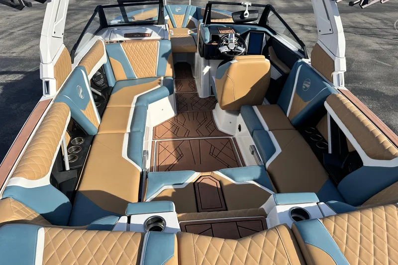 Slide: The Image of Luxurious interior of 2023 Tigé 23ZX boat with tan and blue seating. - 7