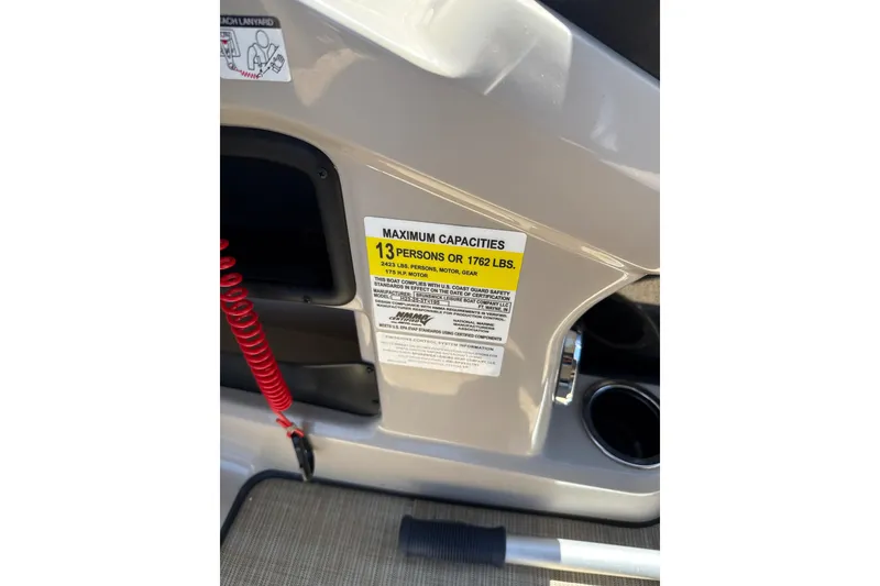 Slide: The Image of 2024 Harris HCX23 boat capacity label, maximum 13 persons or 1762 lbs. - 11