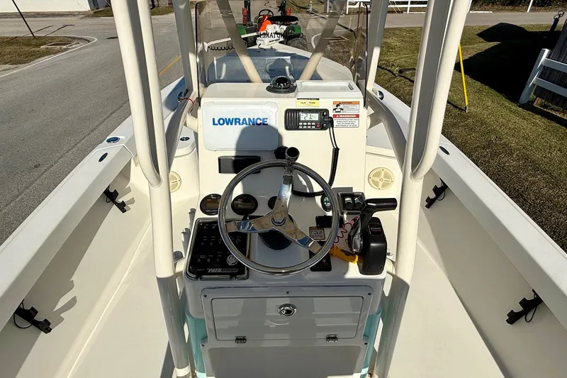 Slide: The Image of 2014 Pathfinder 2400 TRS boat console with steering wheel and Lowrance electronics. - 11