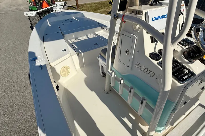 Slide: The Image of 2014 Pathfinder 2400 TRS boat interior with console and seating area. - 13