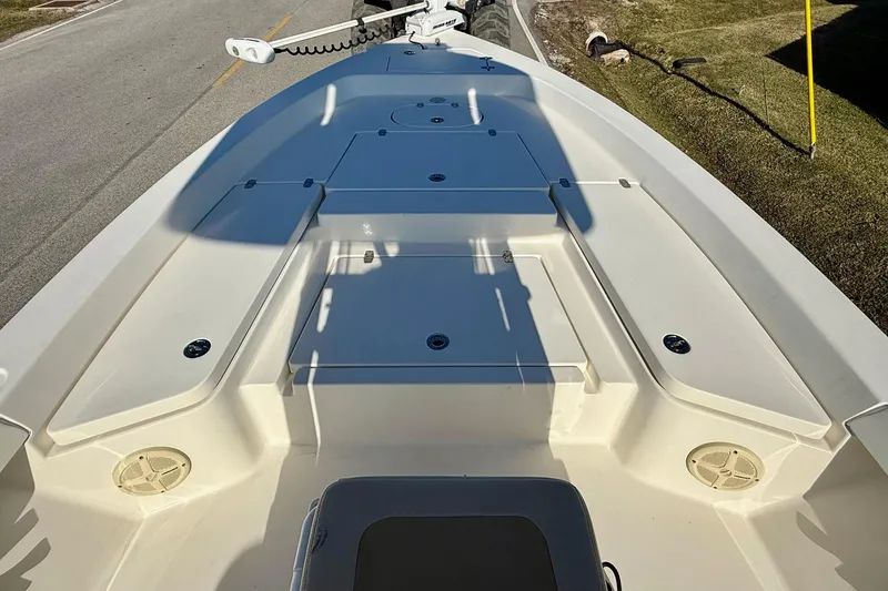 Slide: The Image of 2014 Pathfinder 2400 TRS boat deck with storage compartments and trolling motor. - 14