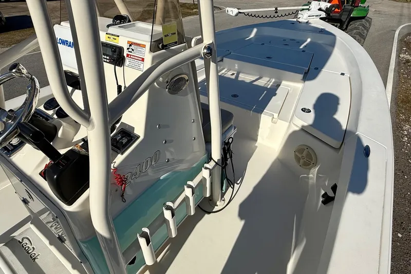 Slide: The Image of 2014 Pathfinder 2400 TRS boat interior with steering console and seating area. - 15
