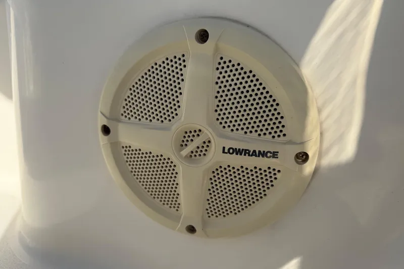 Slide: The Image of Lowrance speaker on 2014 Pathfinder 2400 TRS boat, white background. - 19