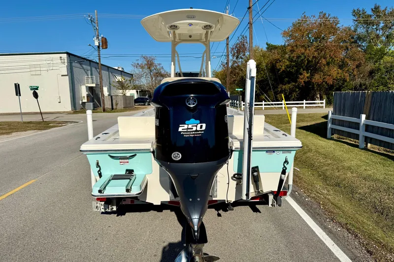 Slide: The Image of 2014 Pathfinder 2400 TRS boat with Yamaha 250 engine on a sunny street. - 3