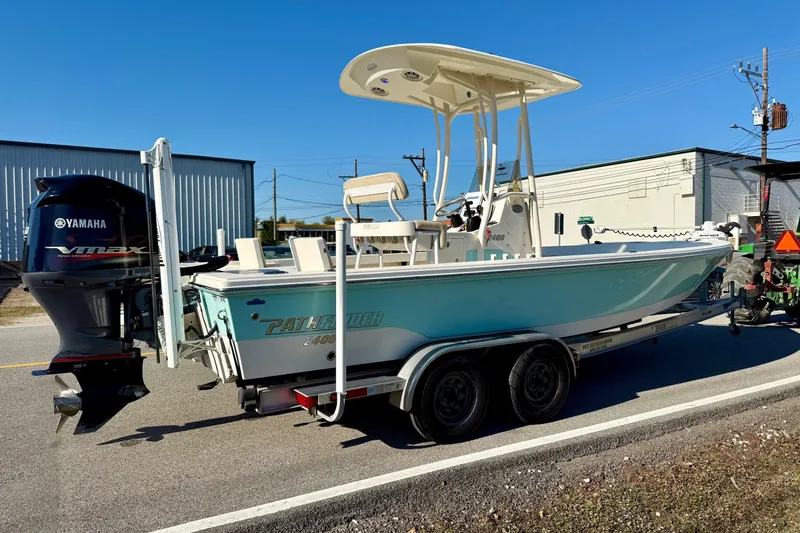 Slide: The Image of 2014 Pathfinder 2400 TRS boat on trailer with Yamaha VMAX engine, parked outdoors. - 4