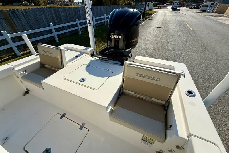 Slide: The Image of 2014 Pathfinder 2400 TRS boat with Yamaha 250 engine, featuring seating and storage compartments. - 7