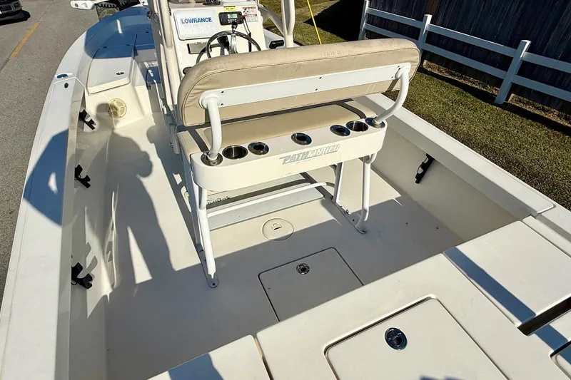 Slide: The Image of 2014 Pathfinder 2400 TRS boat interior with seating and fishing rod holders. - 9