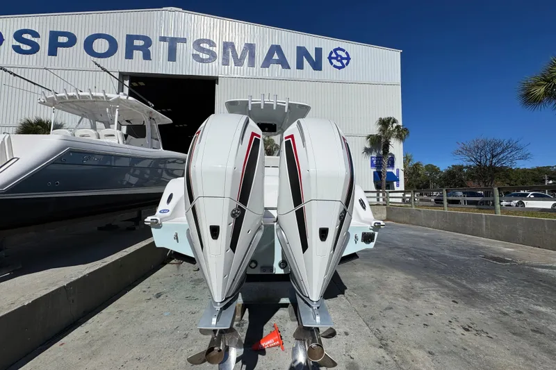 Slide: The Image of 2022 Front Runner 26 Center Console boat with dual engines at a dealership. - 12