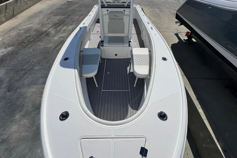 Slide: The Image of 2022 Front Runner 26 Center Console boat with sleek design and spacious seating. - 20