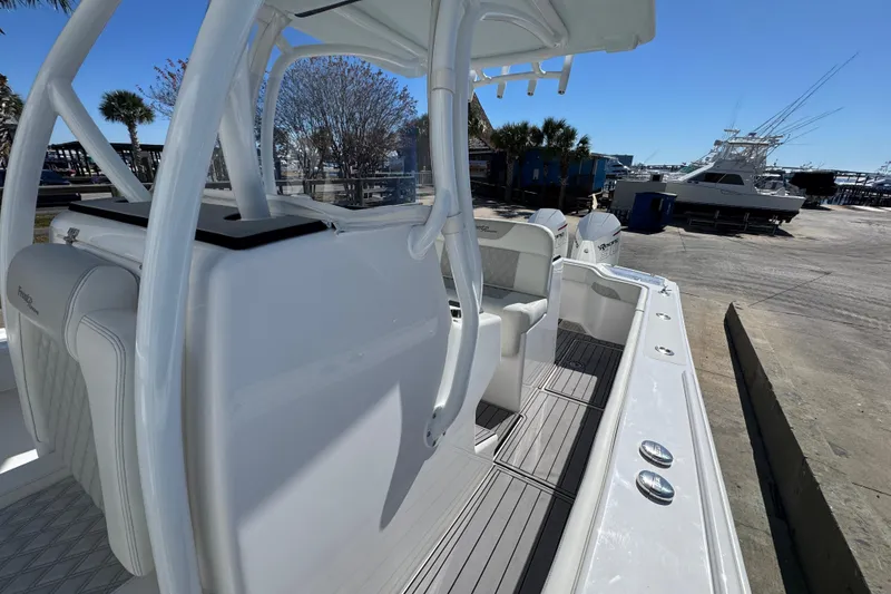 Slide: The Image of 2022 Front Runner 26 Center Console boat docked, showcasing sleek design and spacious deck. - 23