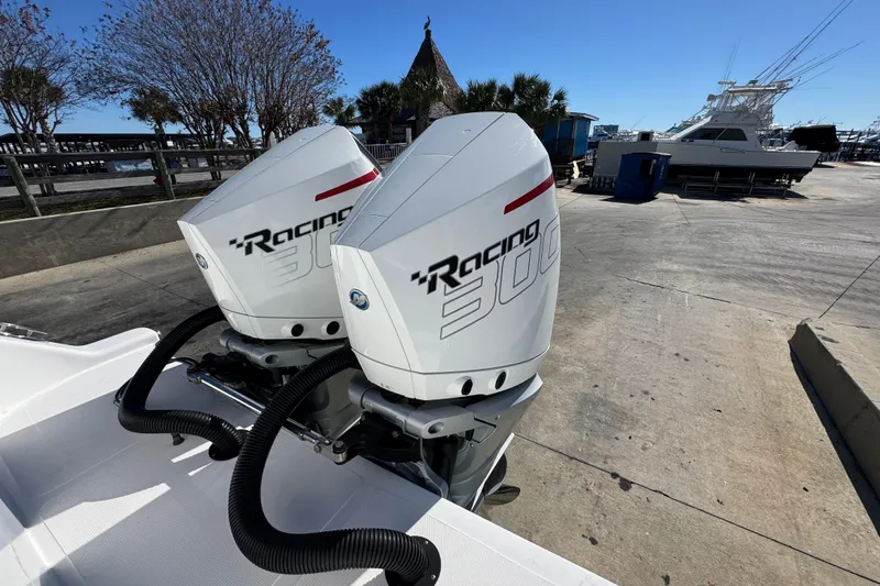 Slide: The Image of Twin Racing 300 outboard engines on a 2022 Front Runner 26 Center Console boat. - 38