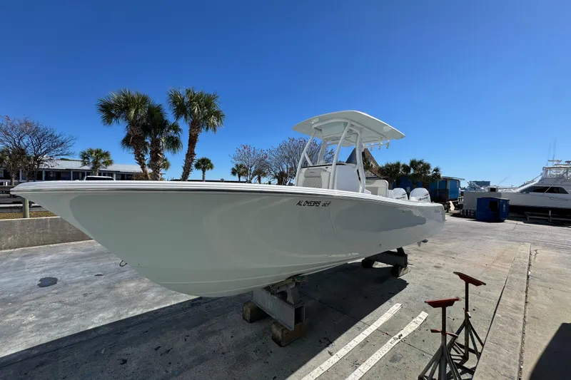 Slide: The Image of 2022 Front Runner 26 Center Console boat on a dock under clear blue sky. - 9