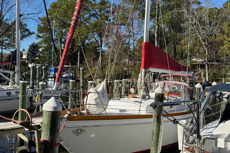 Slide: The Image of Sailboat for sale at marina, Creekmore Cutter 1997, with red sail cover. - 3
