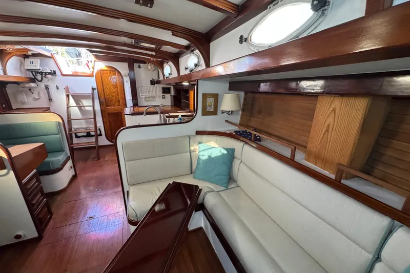 Slide: The Image of Luxurious 1997 Creekmore Cutter yacht interior with elegant wood finishes and cozy seating. - 53