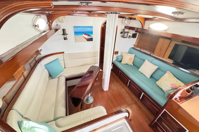 Slide: The Image of Luxurious 1997 Creekmore Cutter yacht interior with elegant seating and nautical decor. - 61