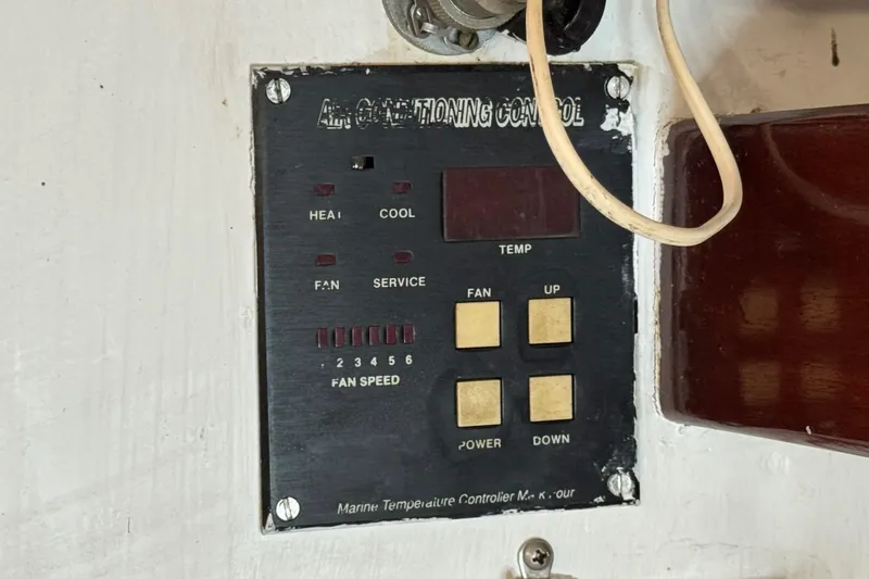 Slide: The Image of Control panel for air conditioning on a 1997 Creekmore Cutter boat. - 69