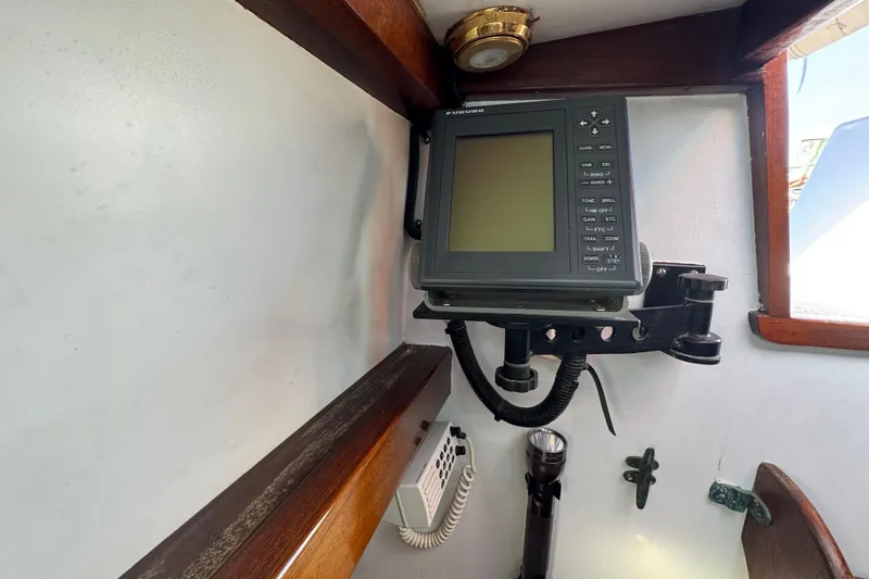 Slide: The Image of Navigation equipment inside a 1997 Creekmore Cutter sailboat cabin. - 74