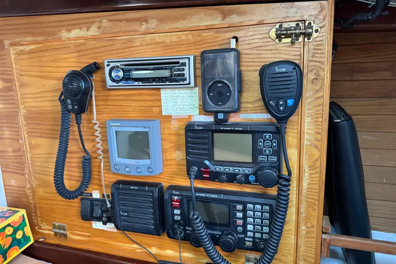 Slide: The Image of Control panel of a 1997 Creekmore Cutter with communication and navigation equipment. - 80