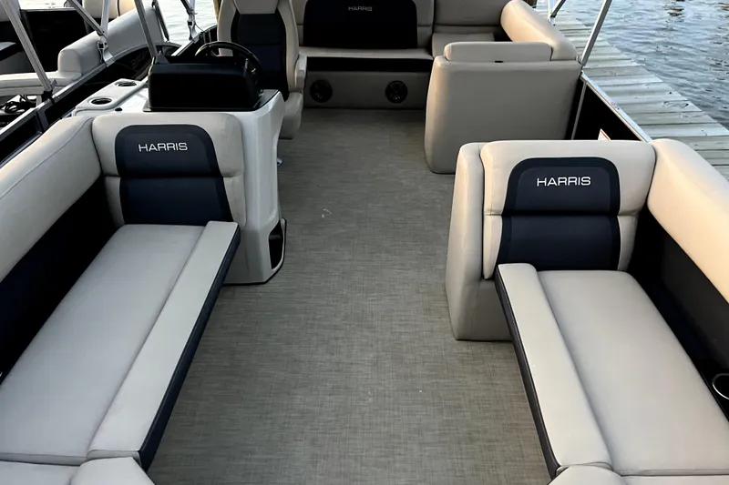 Slide: The Image of 2024 Harris HCX23 boat interior with luxurious seating and modern design. - 7