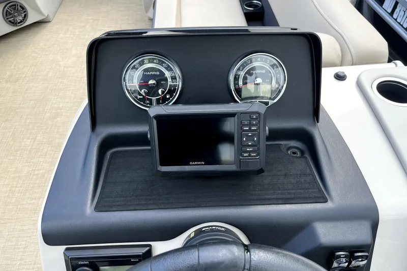 Slide: The Image of Dashboard of 2024 Harris HCX23 boat with Garmin display and gauges. - 8