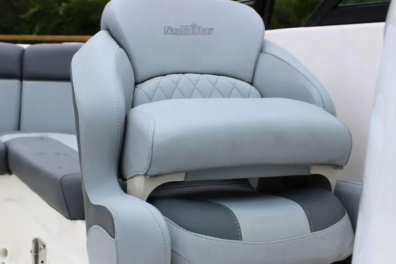 Slide: The Image of 2023 NauticStar 243 DC Deck boat seat with elegant gray upholstery. - 12