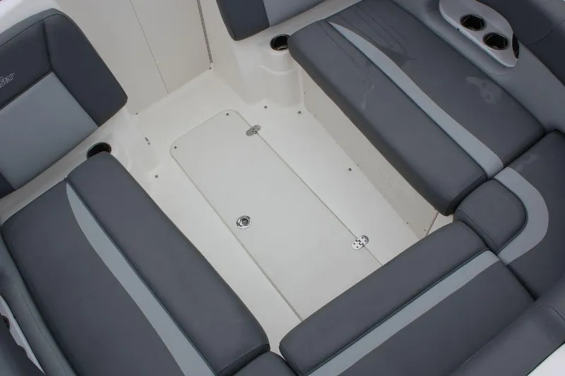 Slide: The Image of 2023 NauticStar 243 DC Deck boat interior with gray seating and cup holders. - 14