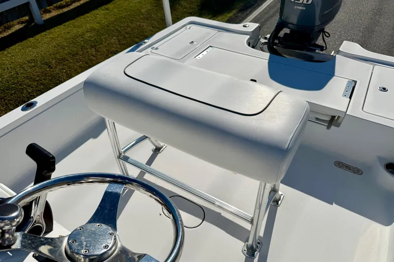 Slide: The Image of 2014 Sportsman Tournament 214 Bay Boat interior with steering wheel and seating. - 10