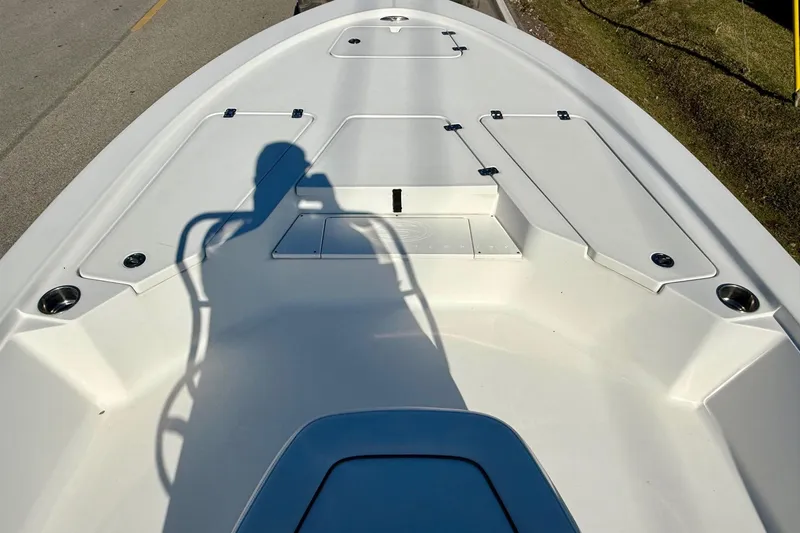 Slide: The Image of 2014 Sportsman Tournament 214 Bay Boat deck with shadow and storage compartments. - 13