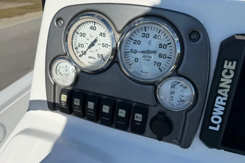 Slide: The Image of Dashboard of 2014 Sportsman Tournament 214 Bay Boat with gauges and Lowrance device. - 17