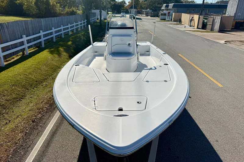 Slide: The Image of 2014 Sportsman Tournament 214 Bay Boat on a road, showcasing its sleek design. - 6