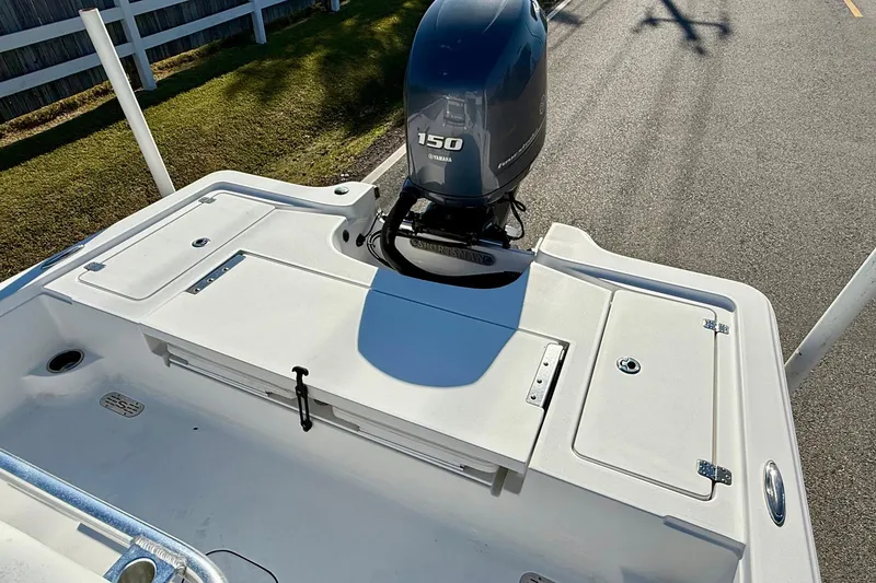 Slide: The Image of 2014 Sportsman Tournament 214 Bay Boat with Yamaha 150 engine, parked on road. - 8